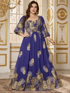 Detail of plus size maxi dress with lantern sleeves and elegant floral print on chiffon fabric