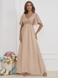 Detail of V-neck evening gown featuring shiny sequins and elegant ruffle short sleeves