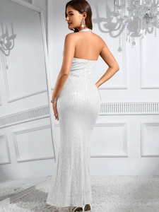 Detail of elegant white sequined backless mermaid dress with halter neck design