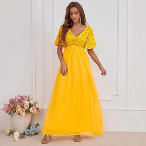 Elegant bright yellow V-neck maxi dress with sequin bodice and flowing chiffon skirt