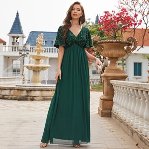 Elegant dark green V-neck evening gown with sequins and flowing chiffon maxi skirt