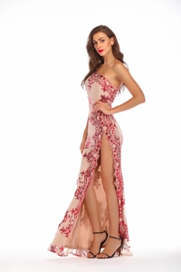 Detail shot of the sequin embroidery and high slit on this elegant one-shoulder evening gown