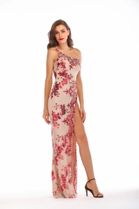 Detail of sequin floral pattern on an elegant one-shoulder evening dress with high slit