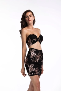 Detail of black two-piece set with rose gold sequins and floral embroidery patterns