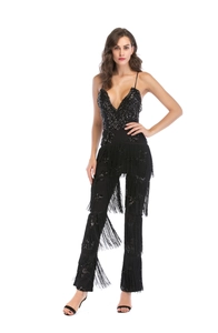 Detailed macro view of black sequined fringe jumpsuit for party and stage wear