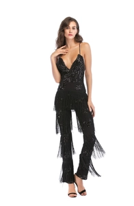 Detail view of the black sequined jumpsuit with layered fringe tassels and a deep V-neckline