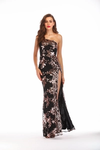 Detailed view of black sequined evening gown with gold floral embroidery and side slit