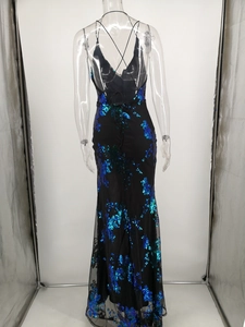 Detail of sequined long dress showing cross back straps and floral sequin pattern