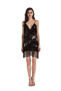 Detail shot of vintage sequins and long fringe on a black flapper style mini dress