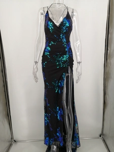 Detail of green and blue sequin floral pattern on a sexy V-neck high slit formal gown
