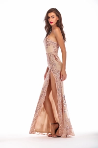 Close-up detail of champagne sequin floral embroidery and high-slit on evening dress