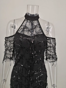 Detail of cold shoulder sequins dress with mesh paneling and wavy embroidery texture