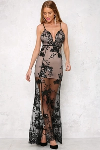 Detail of sheer black lace embroidery with sequins on a nude evening gown bodice