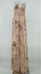 Detail of rose gold sequin mesh evening gown with deep V-neck and spaghetti straps
