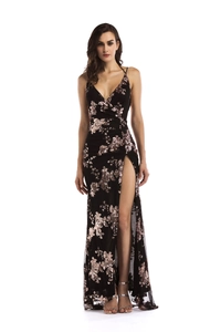 Detail of elegant black evening gown with rose gold sequins and a high side slit