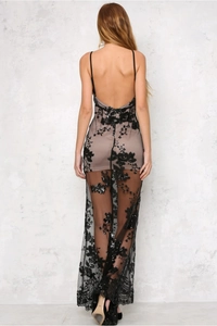 Detailed back view of a black sequin evening dress with lace and open back design