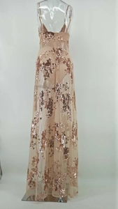 Close-up of rose gold sequins on sheer mesh evening dress with backless halter design