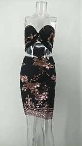 Detail of black sequined two-piece set featuring a cross-knotted tube top and mini skirt