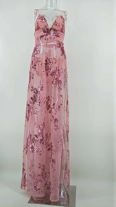 Detail of pink sequin evening dress featuring thin straps, deep V-neck and high slit design