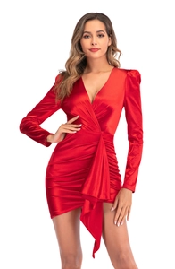 Detail of red satin dress featuring a deep V-neckline and elegant waist ruching details