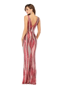 Close-up of sparkling red and silver sequin dress with backless V-neck and mermaid tail