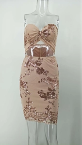 Detailed view of champagne pink sequin two-piece set with intricate floral patterns