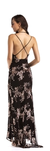 Detail of cross back straps and shimmering rose gold sequins on a black evening gown