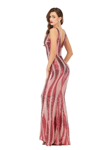 Detail of red and white sequin evening gown showing the deep V-back and fishtail hemline