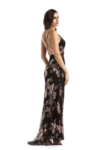 Detail of cross-back straps and rose gold floral sequins on a sexy black evening dress