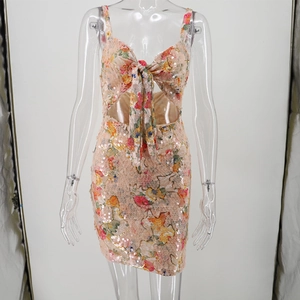 Detail of sequined floral bodycon mini dress featuring side cut-outs and bow neckline