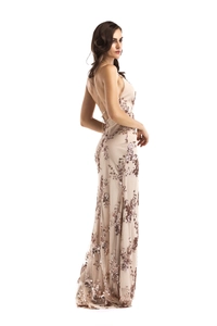 Detail of rose gold sequin embroidery on backless evening dress with slim straps