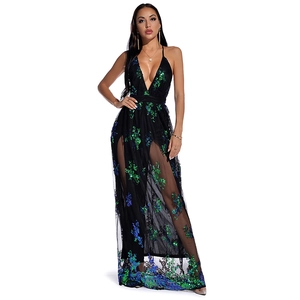 Detailed view of green sequin floral embroidery on a black mesh evening dress