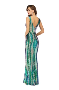 Macro detail of sequin texture and open-back design on a mermaid evening gown