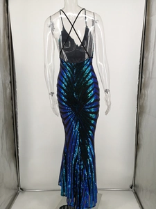 Detail of the cross-back straps on a sequined evening gown with blue and green gradients