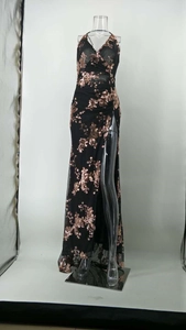 Close-up detail of rose gold sequin floral embroidery on a sexy V-neck mesh evening dress