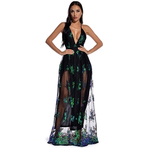 Detail of deep V-neck sequin dress with green embroidery and sheer mesh hem