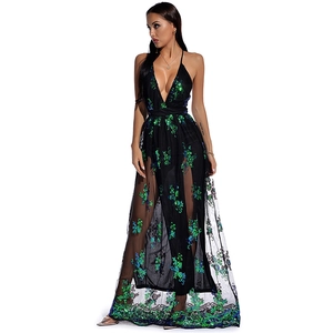 Detail of a deep V-neck sequined maxi dress with green floral patterns and mesh fabric