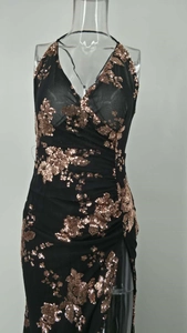 Detail of V-neck sequin evening dress with rose gold floral embroidery and high side slit