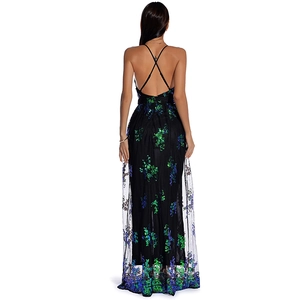 Close-up of elegant criss-cross back straps on black sequin floral evening dress