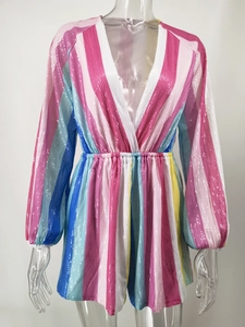 Close-up of deep V-neck striped sequin romper with colorful vertical patterns and long sleeves