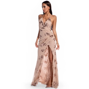Close-up of champagne evening dress featuring rose gold floral sequins and mesh fabric