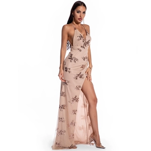 Detail of rose gold sequins on champagne halter gown with a high leg slit design