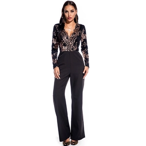 Detailed view of the deep V-neckline featuring intricate gold sequins on the long sleeve jumpsuit