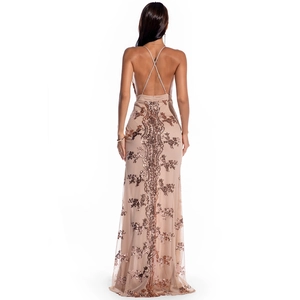 Macro shot of rose gold backless sequin dress featuring criss-cross straps and mermaid hem