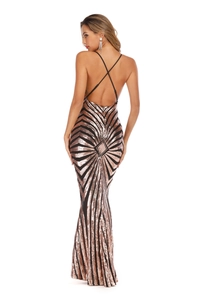 Macro detail of criss-cross back straps and shimmering rose gold sequins on long dress