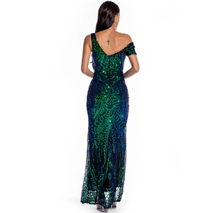 Detailed back view of sequin evening gown featuring peacock feather patterns and mermaid hem