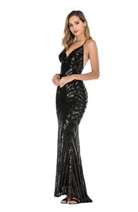 Close-up of geometric sequin patterns and thin straps on black V-neck evening gown