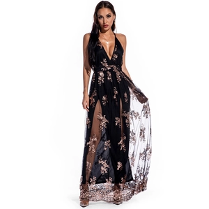 Detail of sequin floral embroidery and high side slit on black mesh evening gown