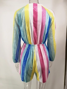 Rear view of long sleeve sequin jumpsuit with colorful vertical rainbow stripes