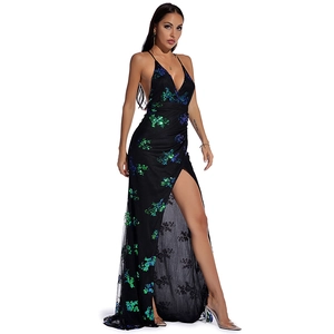 Detail of black sequined evening gown with deep V-neck, open back and high slit